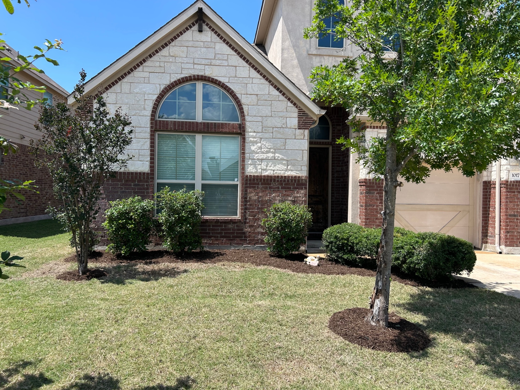 Same front yard after listing prep, photo-ready